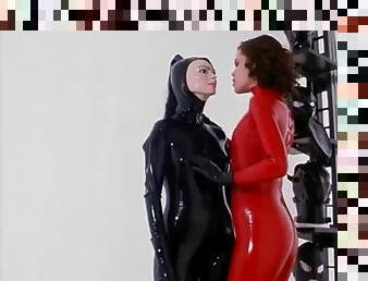 Girls in tight latex are playing with masks