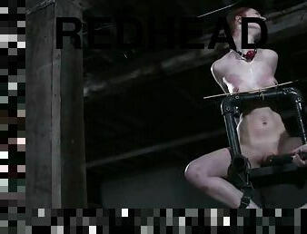 Redhead Calico gets choked and toyed in bondage chair