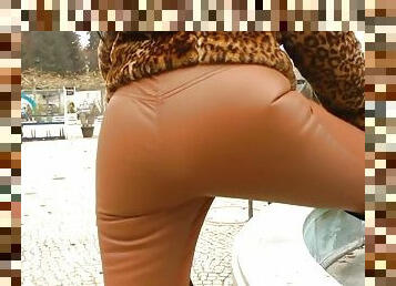 Superb MILF flashing outdoors in tight leather pants
