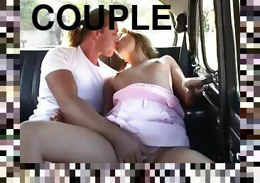 Fun couple fucks in the back seat of a car that is driving down the road