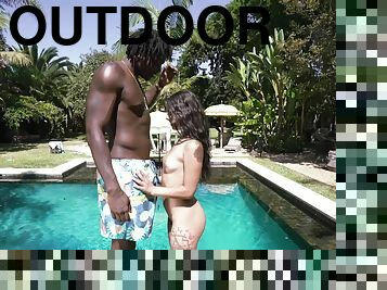 Gorgeous outdoor sex scenes by the pool between a petite girl and a black stud