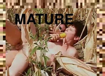 Fucking mature in a field of corn