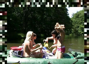 While rafting down a river three girls get naked and eat pussy