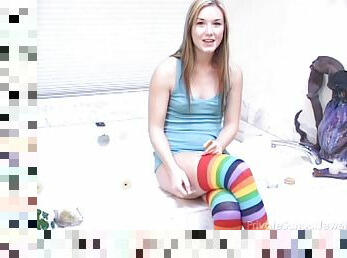 Naughty teen drenches herself in milk in the bath tub