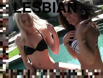 Lesbian floozies sunbathing by the pool and hooking up