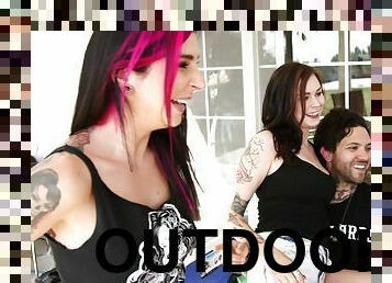 Wild tattooed bitch giving a titjob and sucking a cock outdoors