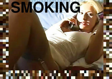 Horny blonde likes smoking while masturbating