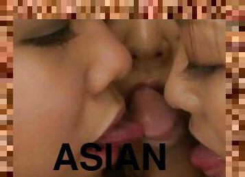 Three Asian babes play with his cock