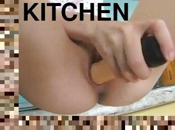 Teen in kitchen toys her bald cunt