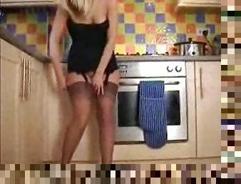 Hot blonde in her kitchen dancing