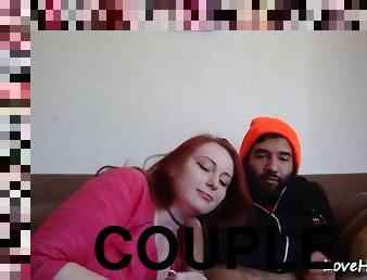 An amazing redhead sucking and rides her boyfriend on the couch