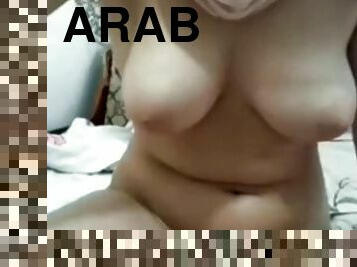 Arab muslim Inaya toying at home