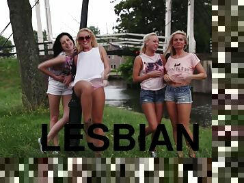 Cute lesbian friends enjoy each other's cunts in public