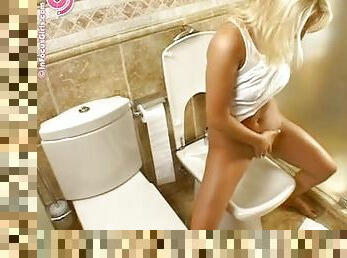 Blonde Babe Taking A Piss In The Bidet.