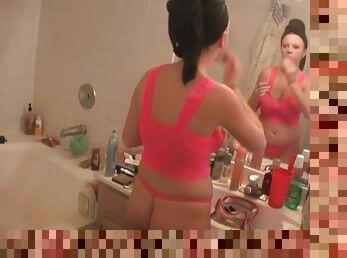 Big tits lingerie girl cleans her face in the bathroom