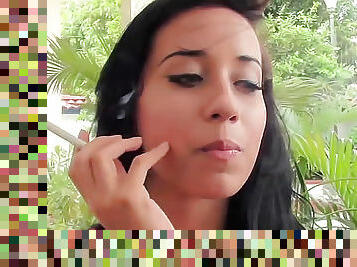 Teen Latina smokes cigarette on camera