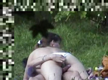 Voyeur clip of couple fucking in a field