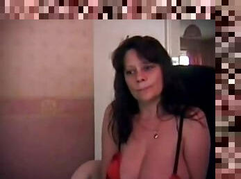 Large breasted mature woman being dirty at the webcam