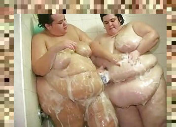 Gigantic women shower together