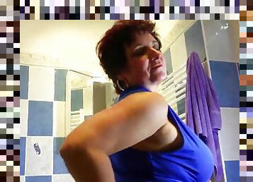 Mature pornstar masturbating with a massive dildo in the shower