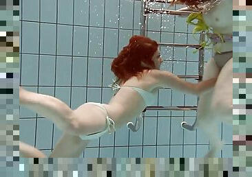 Redhead Russian lesbian shading bikini before swimming