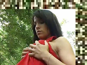 Brunette teen plays with her pussy in the forest