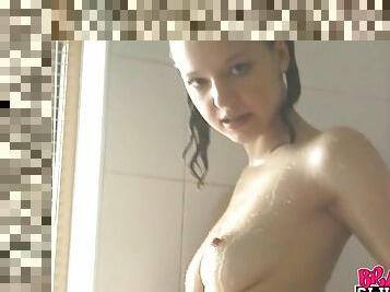 Super tight body teen plays with her pussy in the shower