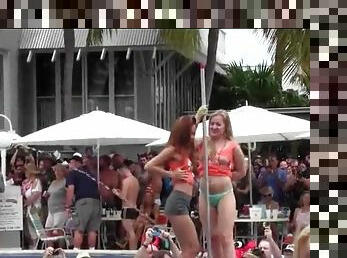 Topless dancing amateurs at a pool party