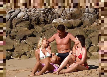 Sharka Blue and Sabine Mallory enjoy a threesome on the beach