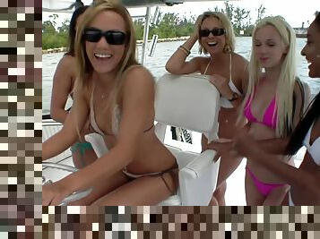 Bikini party girls on a boat suck titties and lick pussy