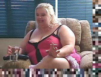 Big busty blonde BBW having a smoke on her couch
