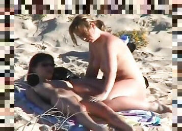 Naked chicks take pics of each other on the beach