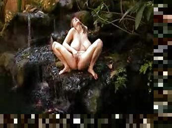 Huge tit chick in nature strips naked