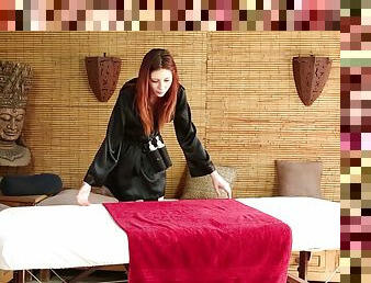 Beautiful redhead sucks a fat dick on the massage table