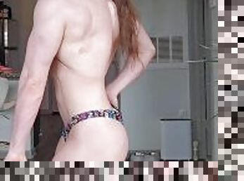 Female bodybuilder topless posing