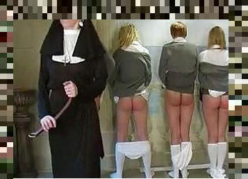 Nun spanks four schoolgirls