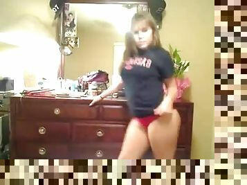 A brown-haired teen shakes her big butt in front of the webcam