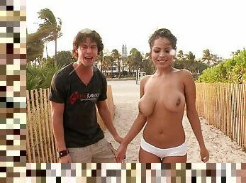 Joyful Busty Latina girl having sex on the beach