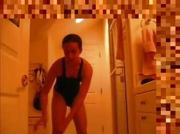 Joyful brunette girl masturbates her pussy in the bathroom