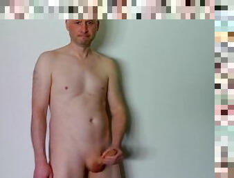 Kudoslong totally naked posing for the camera wanking his erect uncut cock