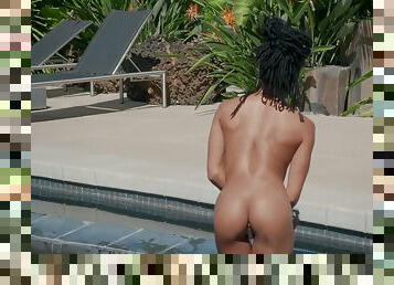 Black beauty Kira Noir gets naked and plays with her pussy in the pool