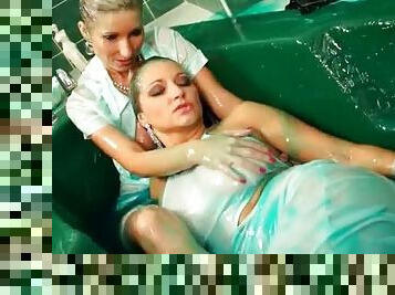 Clothed girls in the tub make a gooey mess
