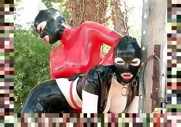 Kinky lesbian latex sex play outdoors