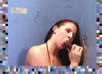 Sexy redhead sucks black cock in bathroom