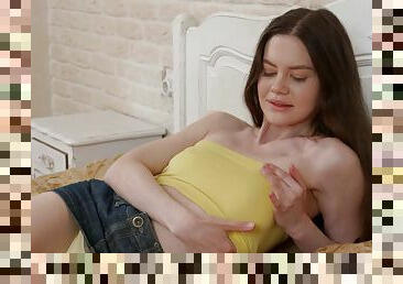 Sweet solo girl Tina Grey spreads her legs to masturbate on the sofa