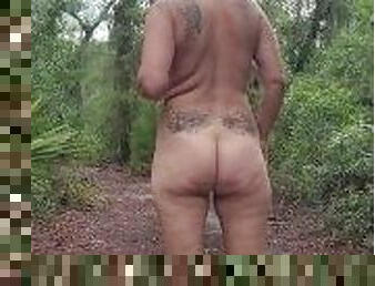 Forest nudist caught wondering in the woods