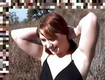 Thick redhead sucking cock outdoors