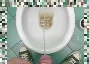 Pissing in public bathroom