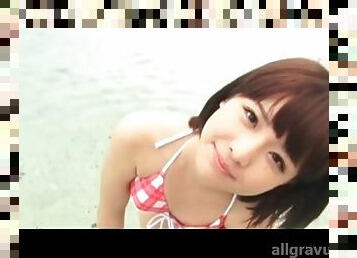 Bikini on a cute Japanese girl in the ocean