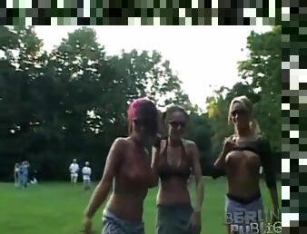 Lesbian threesome in the park with others watching
